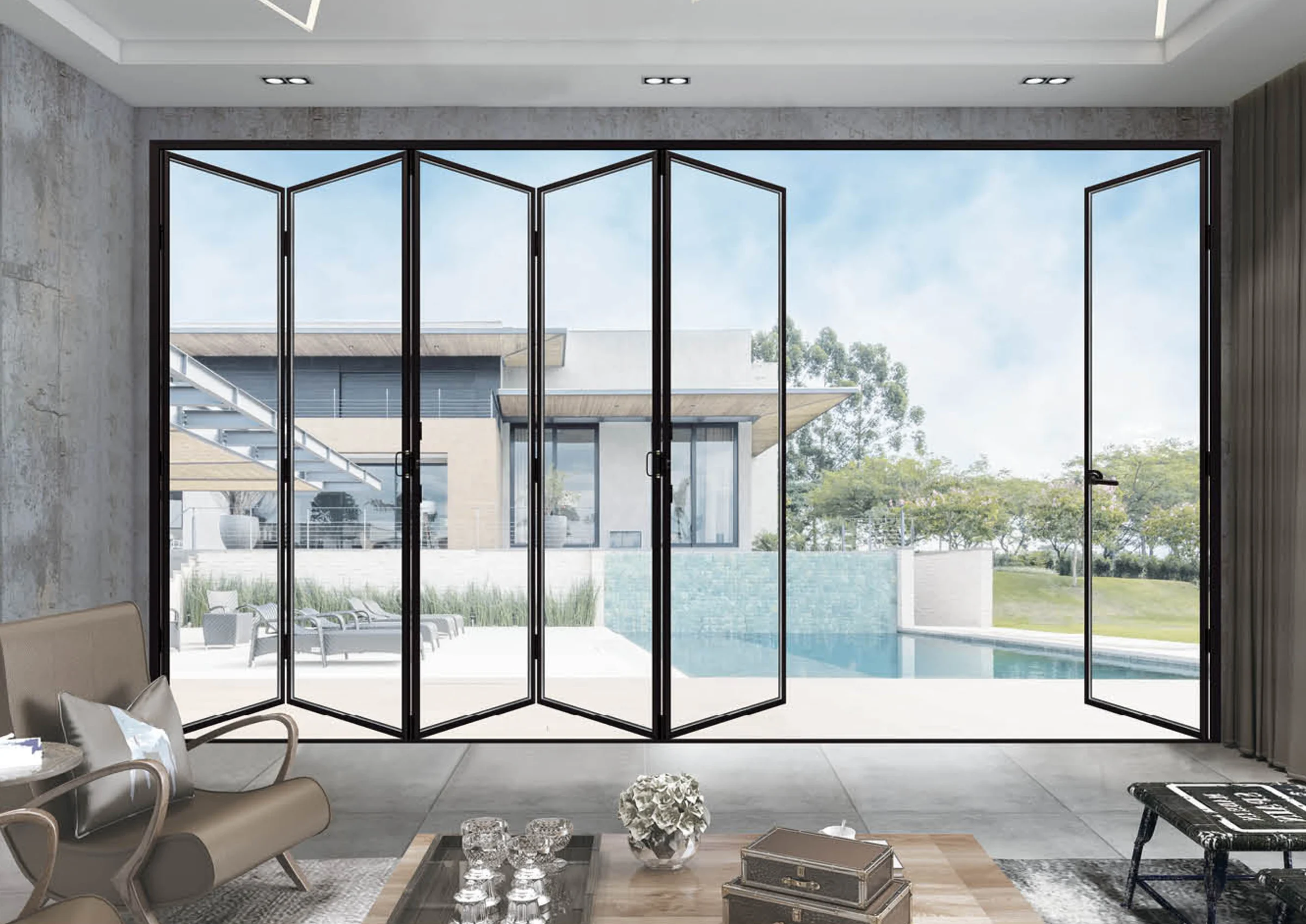 Full-width aluminum bifold doors opening to a pool terrace