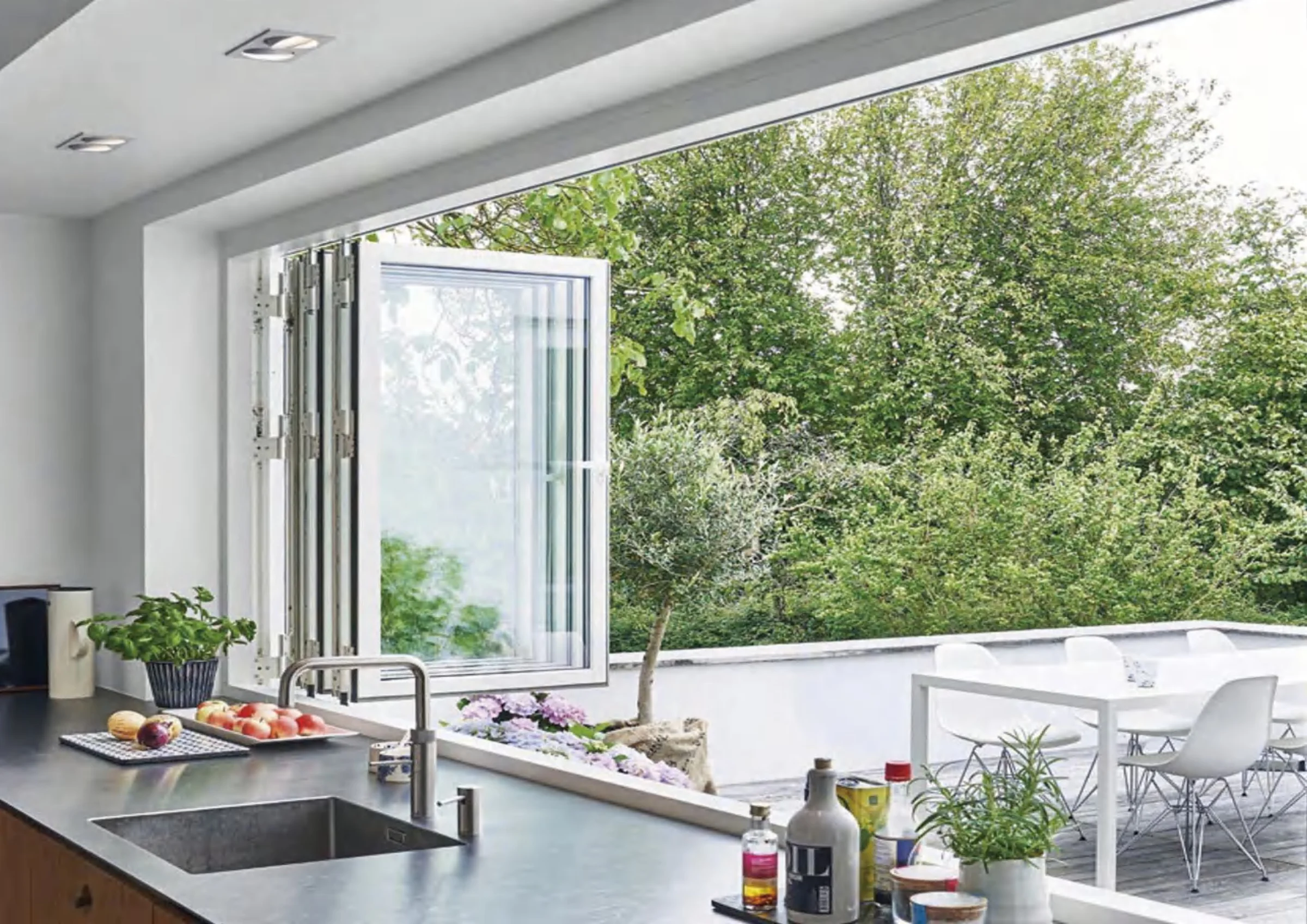 Aluminum casement window opened above a kitchen counter