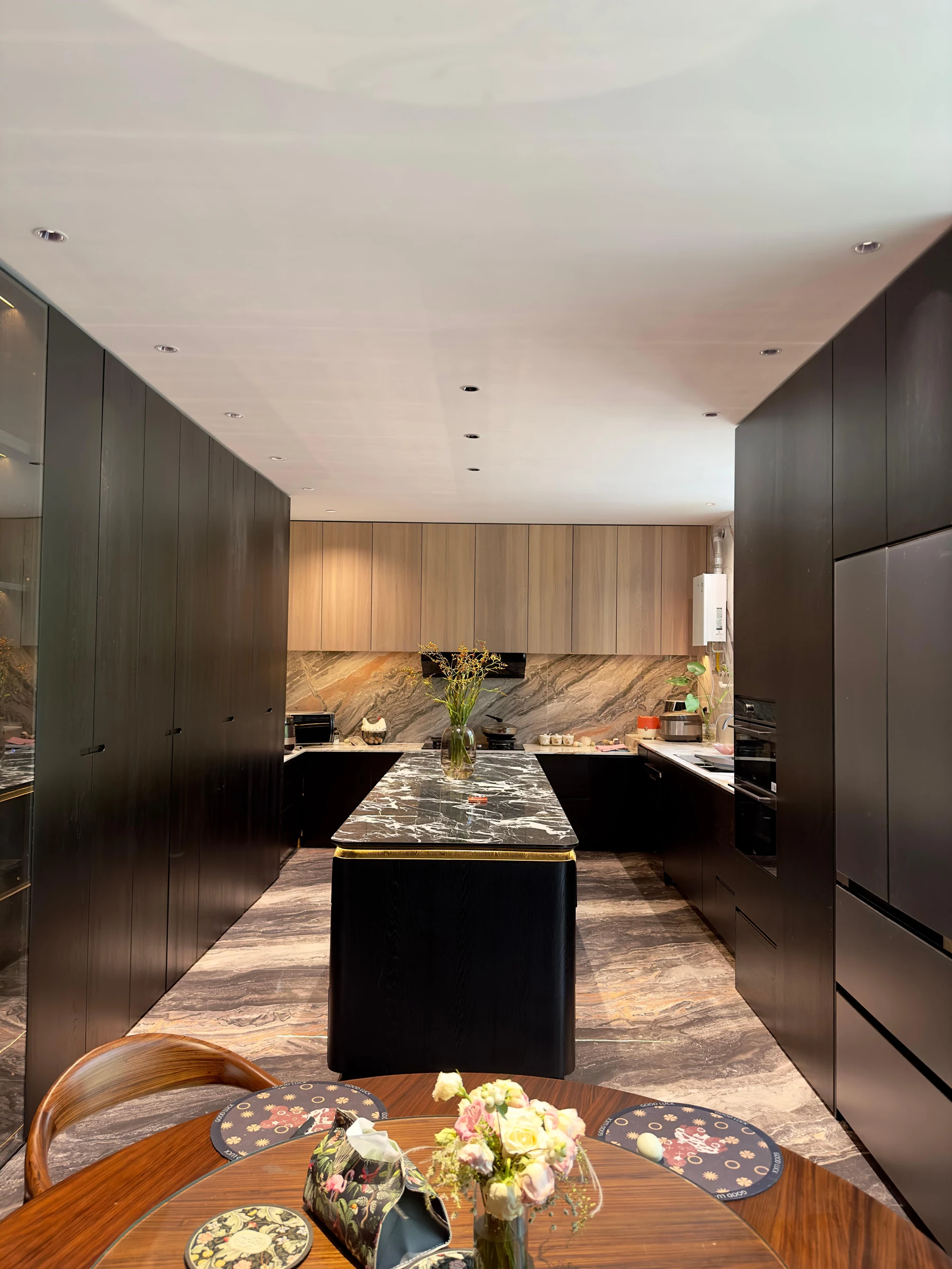 Installed dark wood kitchen with integrated appliances