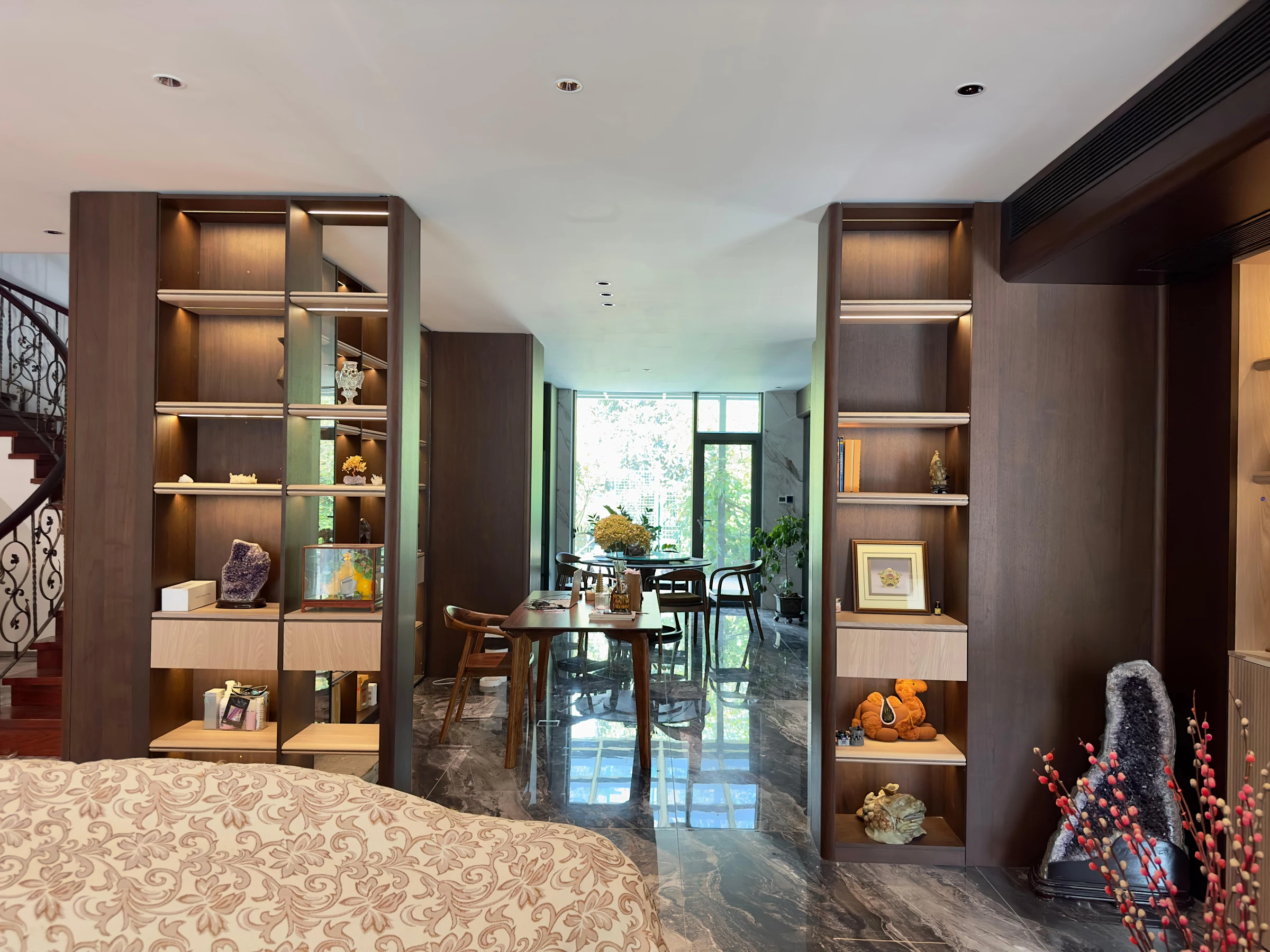 Installed display shelving and space-divider joinery relevant to commercial shared spaces