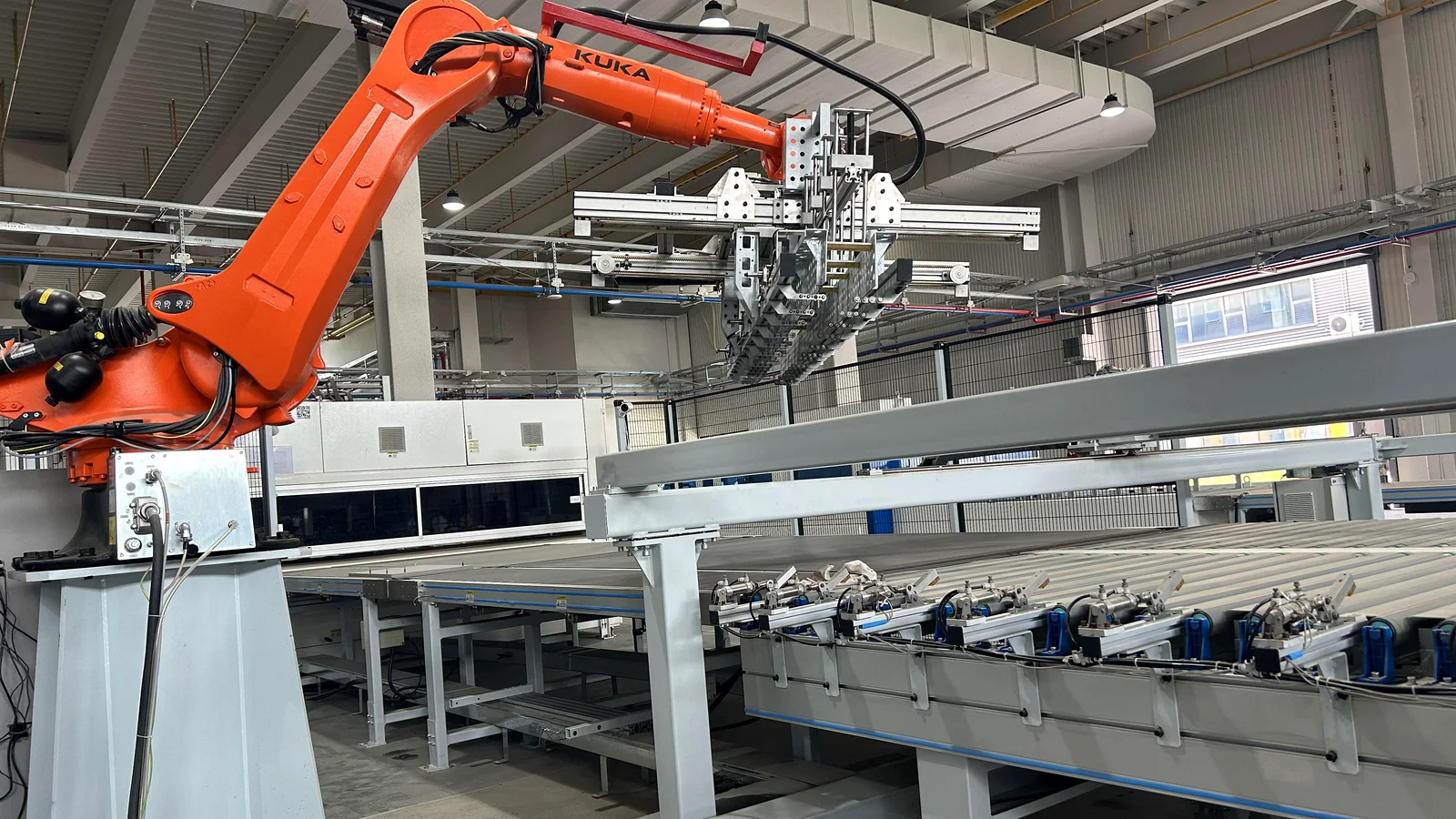 Automated robotic material handling in the cabinet factory