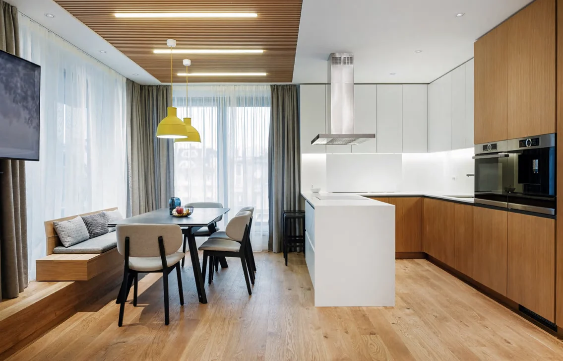 Modern white and wood kitchen in an open-plan apartment