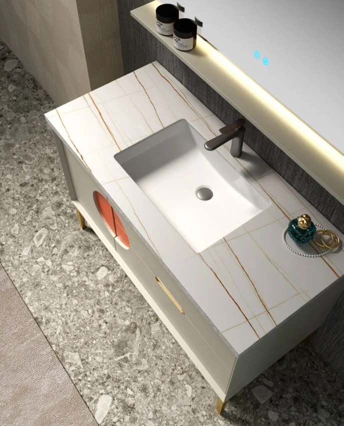 Open bathroom vanity drawer beneath an integrated basin