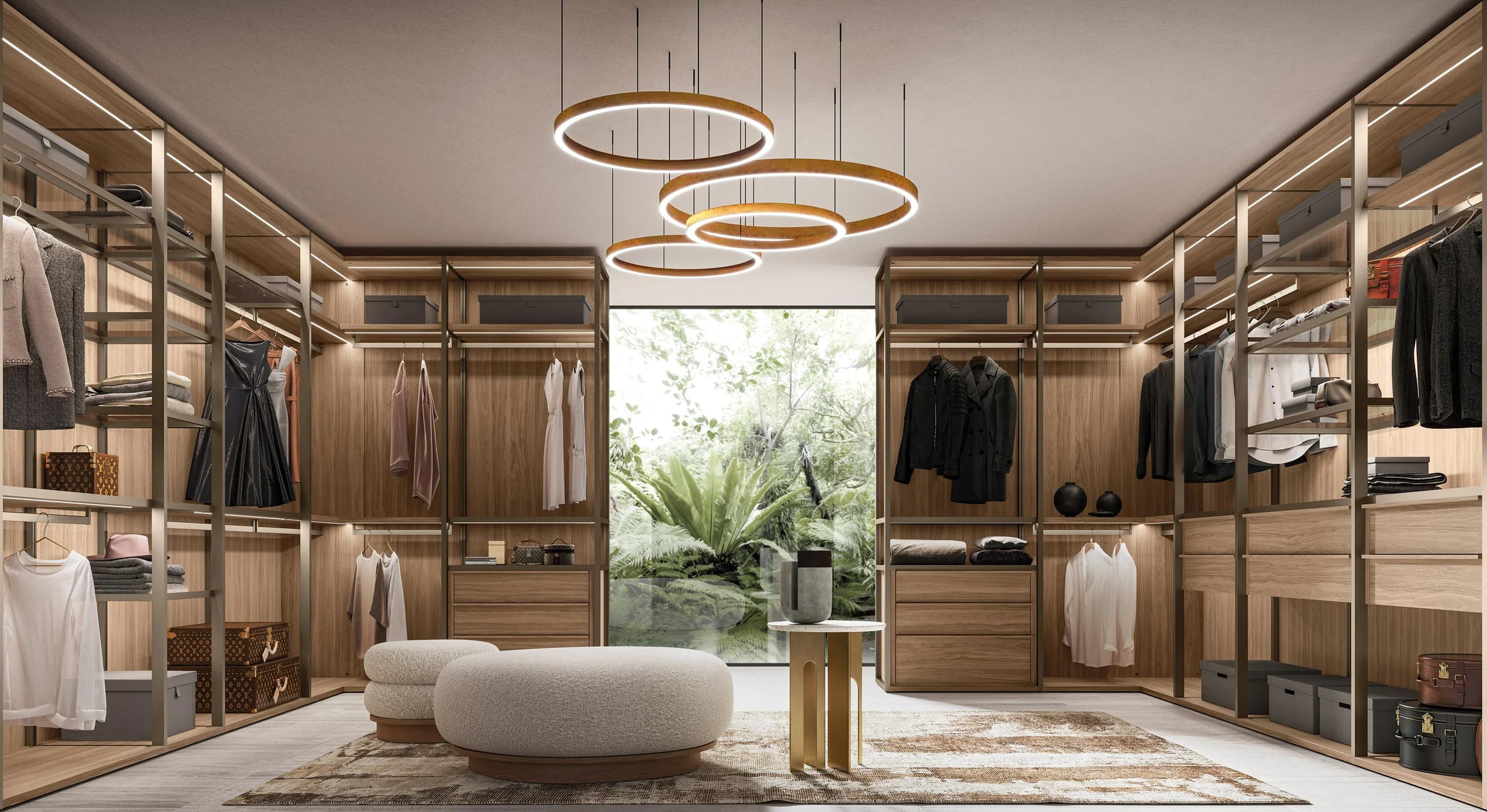 Warm illuminated walk-in wardrobe with open hanging and drawer storage