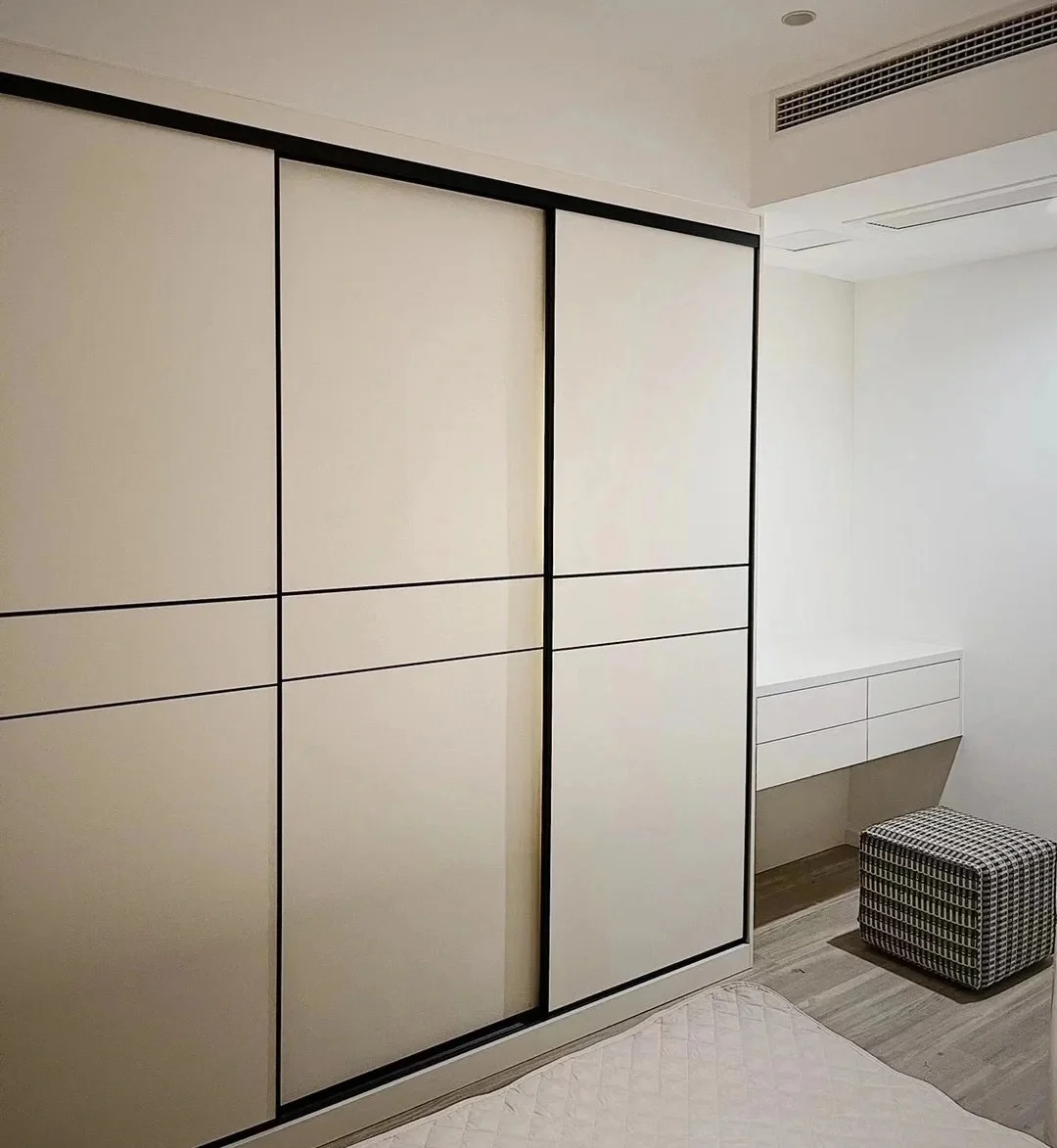 Modern sliding wardrobe with dark framed panels