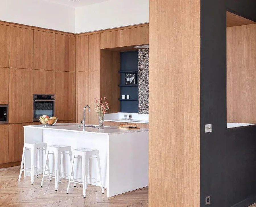 Wood veneer cabinet panels arranged across a kitchen elevation
