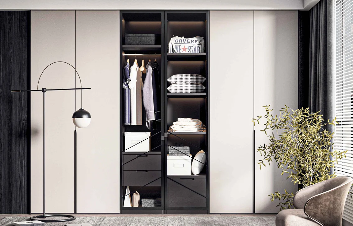 Full-height hinged wardrobe beside bedroom furniture
