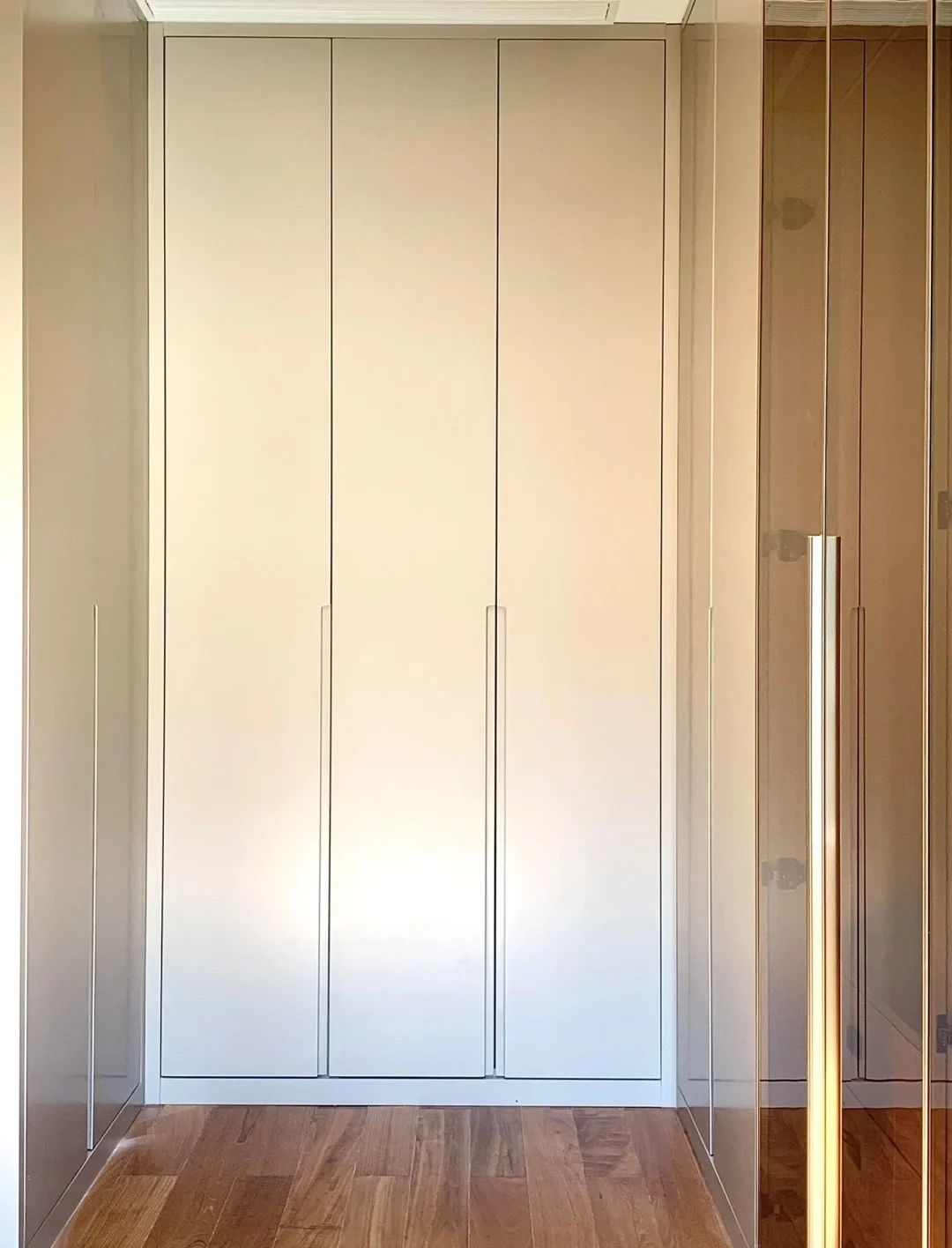 Completed wood-grain melamine wardrobe installation