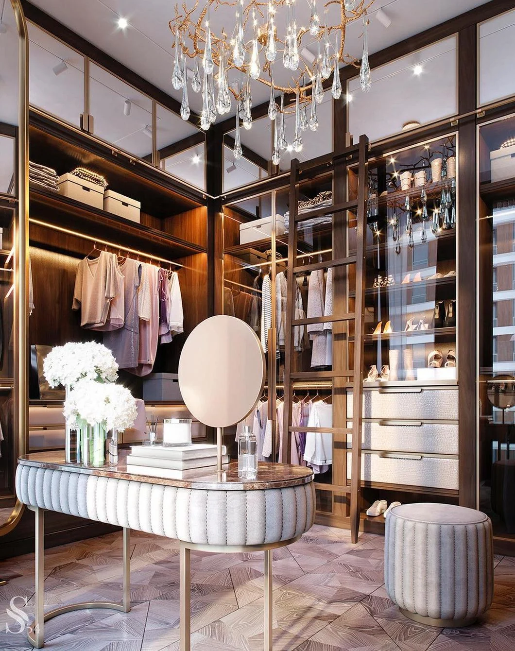 Luxury walk-in closet with storage island and lit cabinets