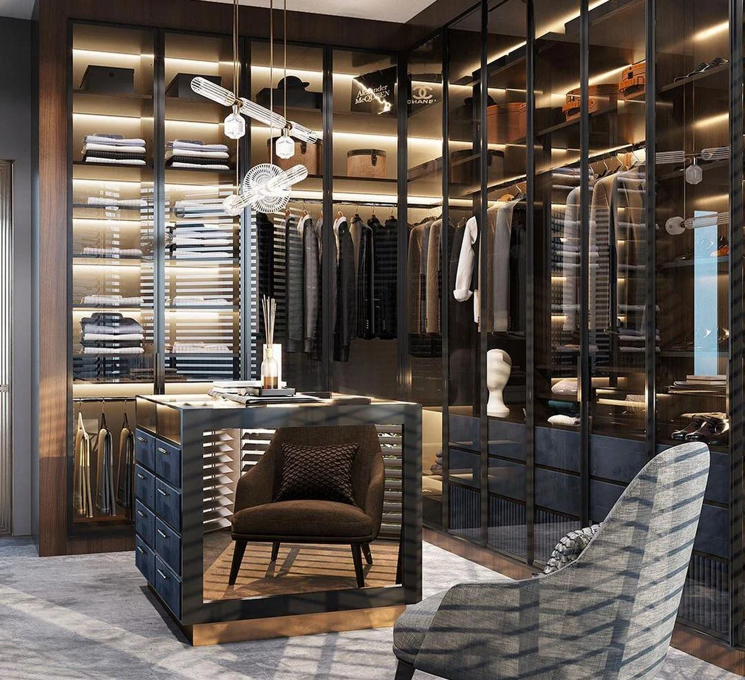 Walk-in closet with organised hanging and drawer zones