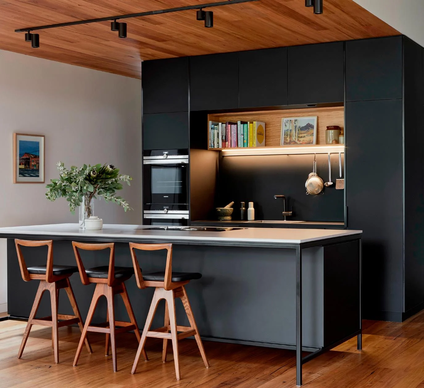 Custom kitchen cabinetry with integrated storage and island