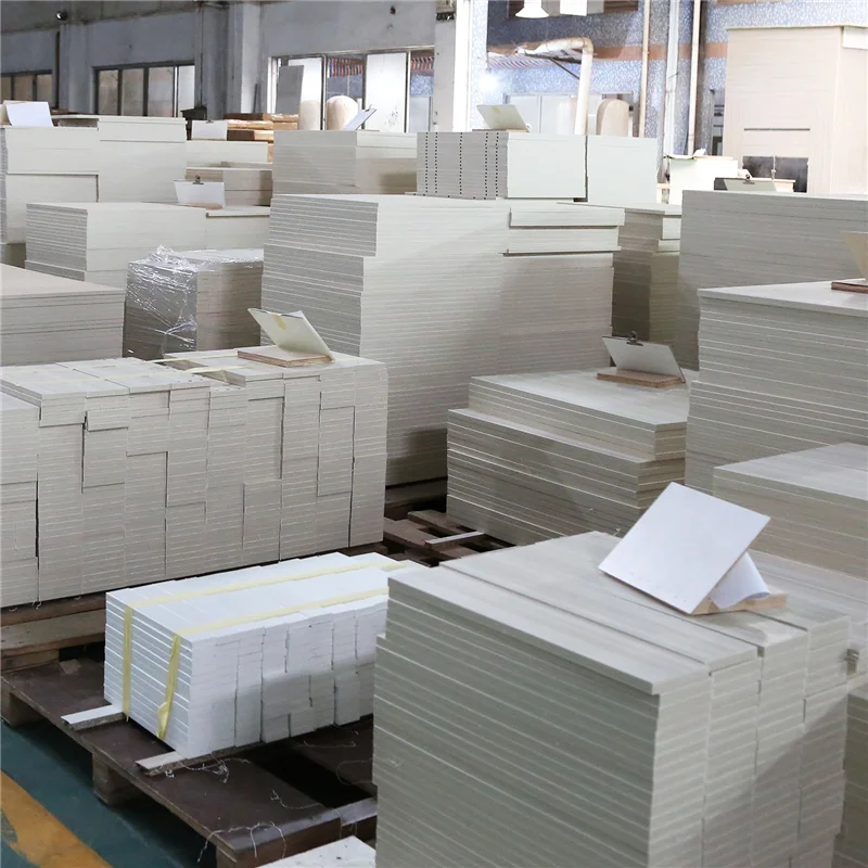 Prepared cabinet panels organized on pallets before assembly