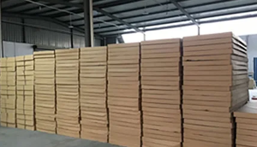 Flat-pack cabinet cartons stacked in the packing area