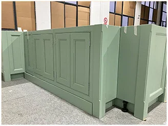Finished green cabinet units grouped for final pre-packing review