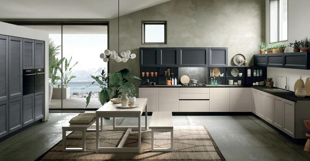Open-plan Shaker kitchen and living area with dark cabinetry